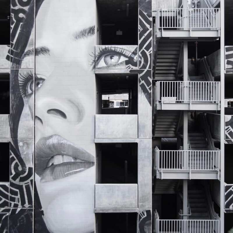 Face on building by Rone
