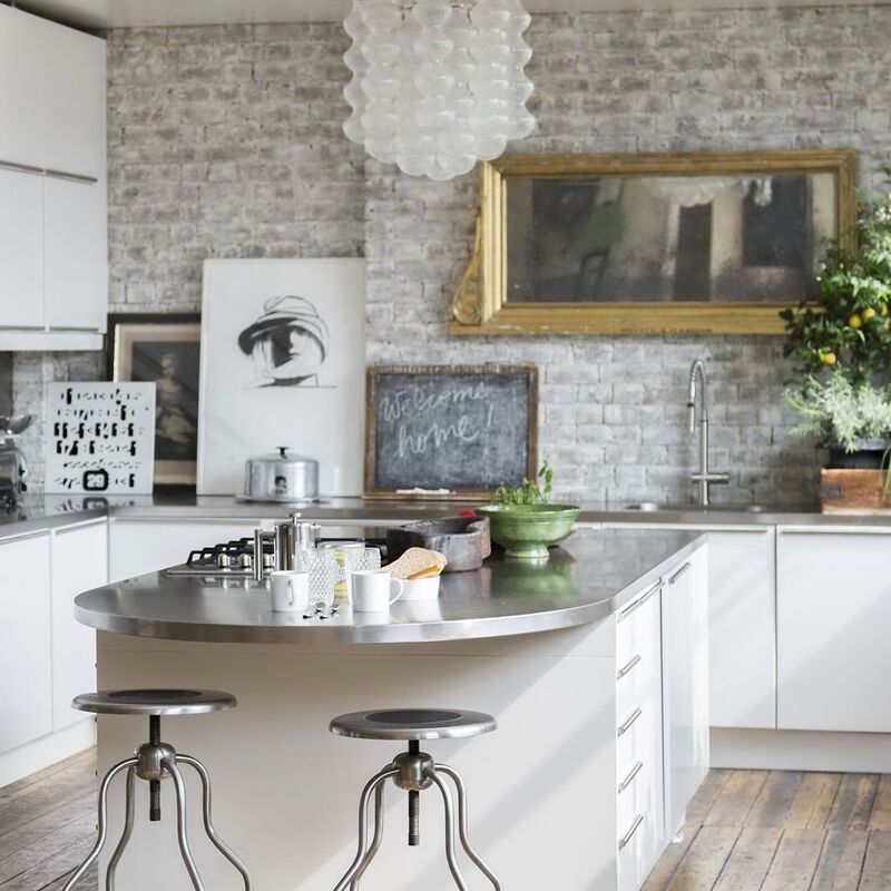 White kitchen with bricks